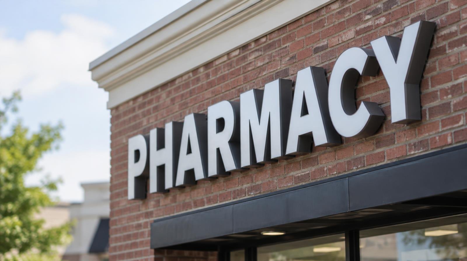 Large channel letters mounted on a brick commercial storefront facade.