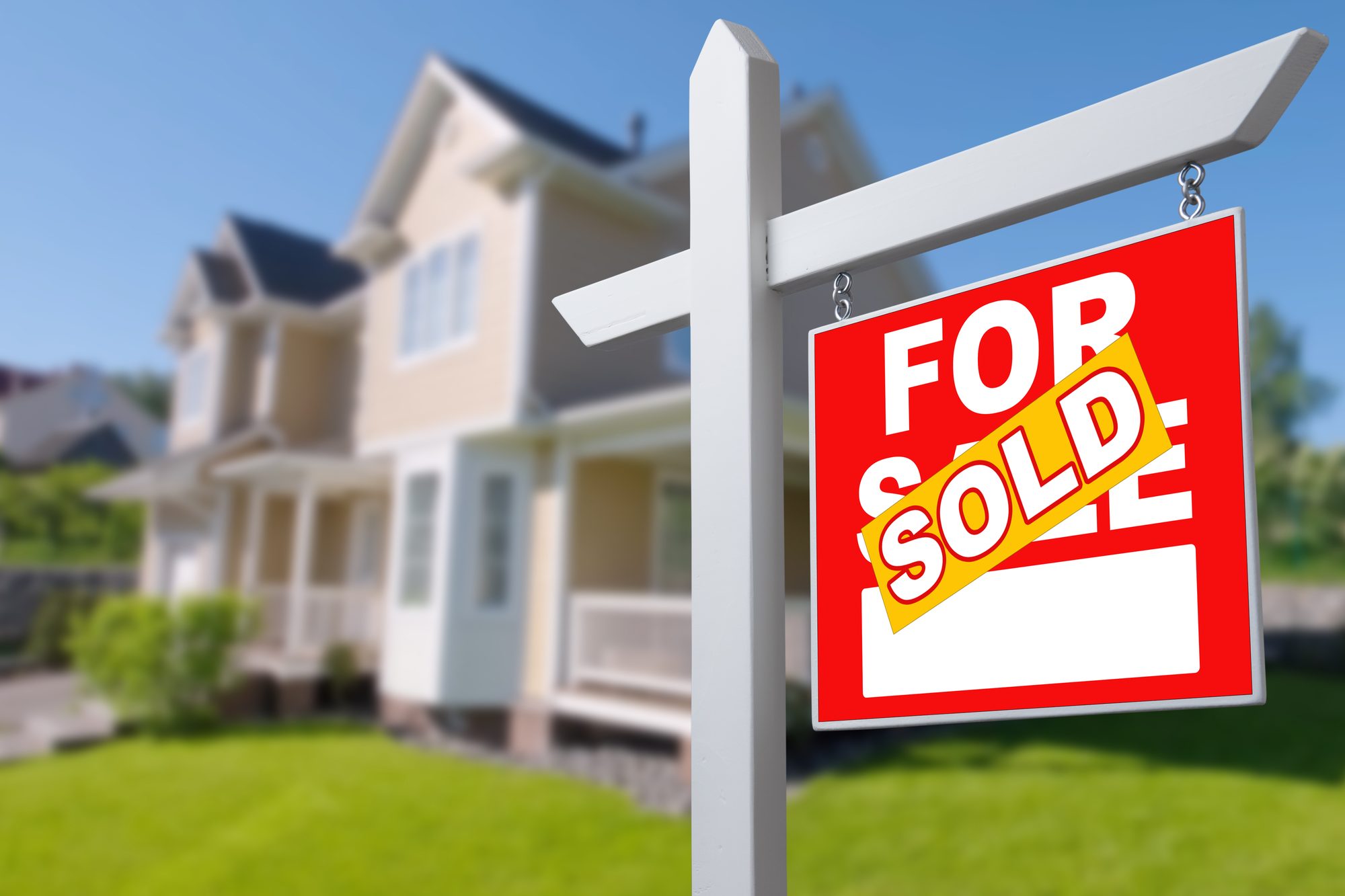 Sold Home For Sale Sign in Front of New House.