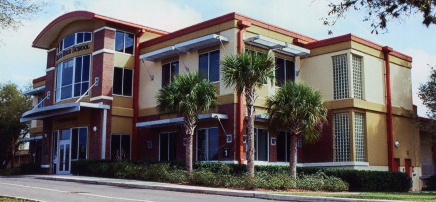 Exterior of a school building with a sign reading Pasco High School.