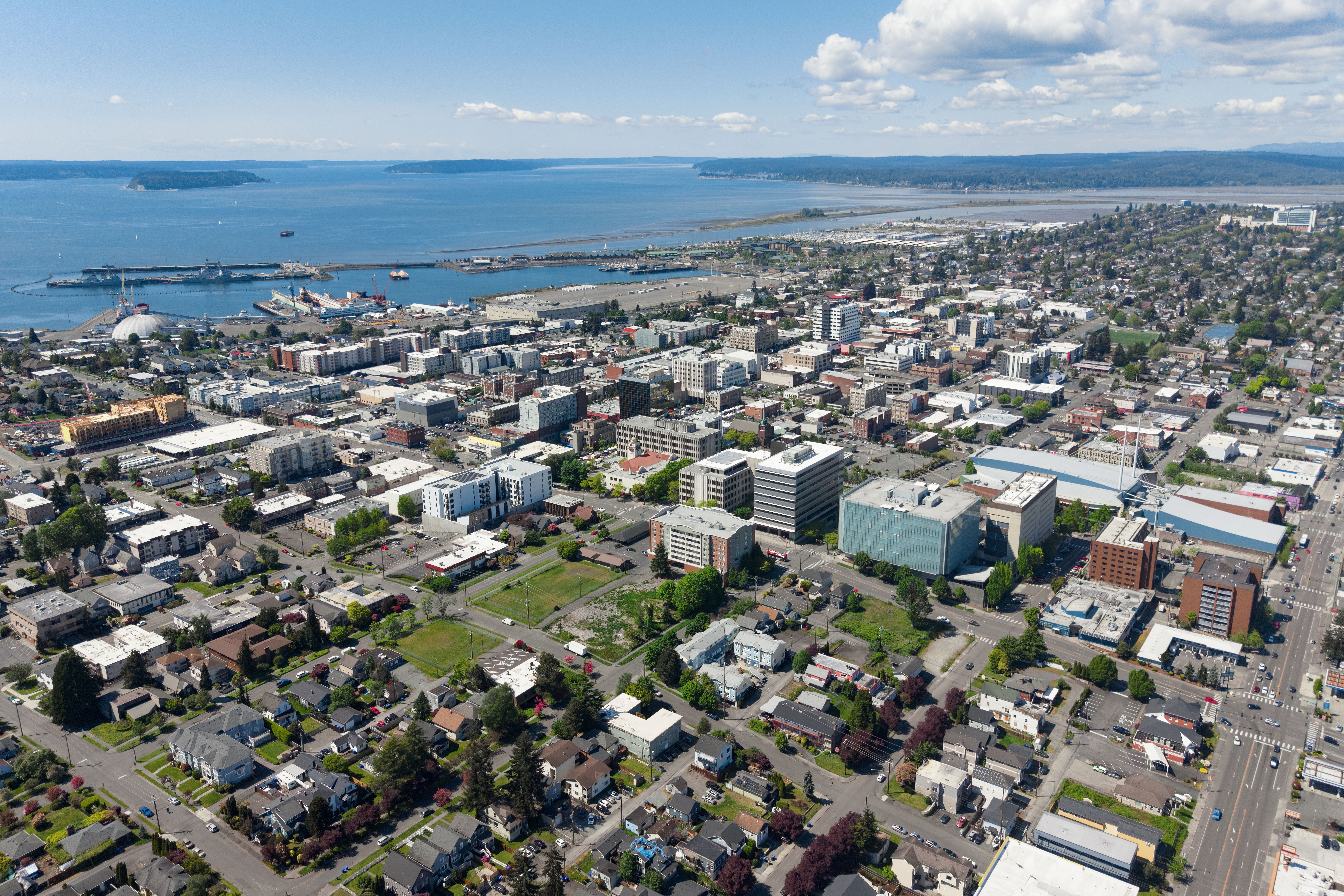 Aerial view of a dense urban downtown area along a waterfront.