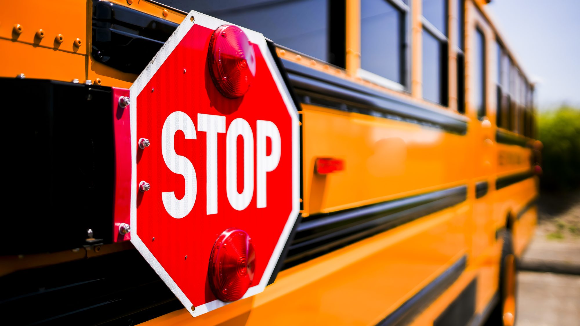 Stop sign on school  bus with selective focusing and with copy space