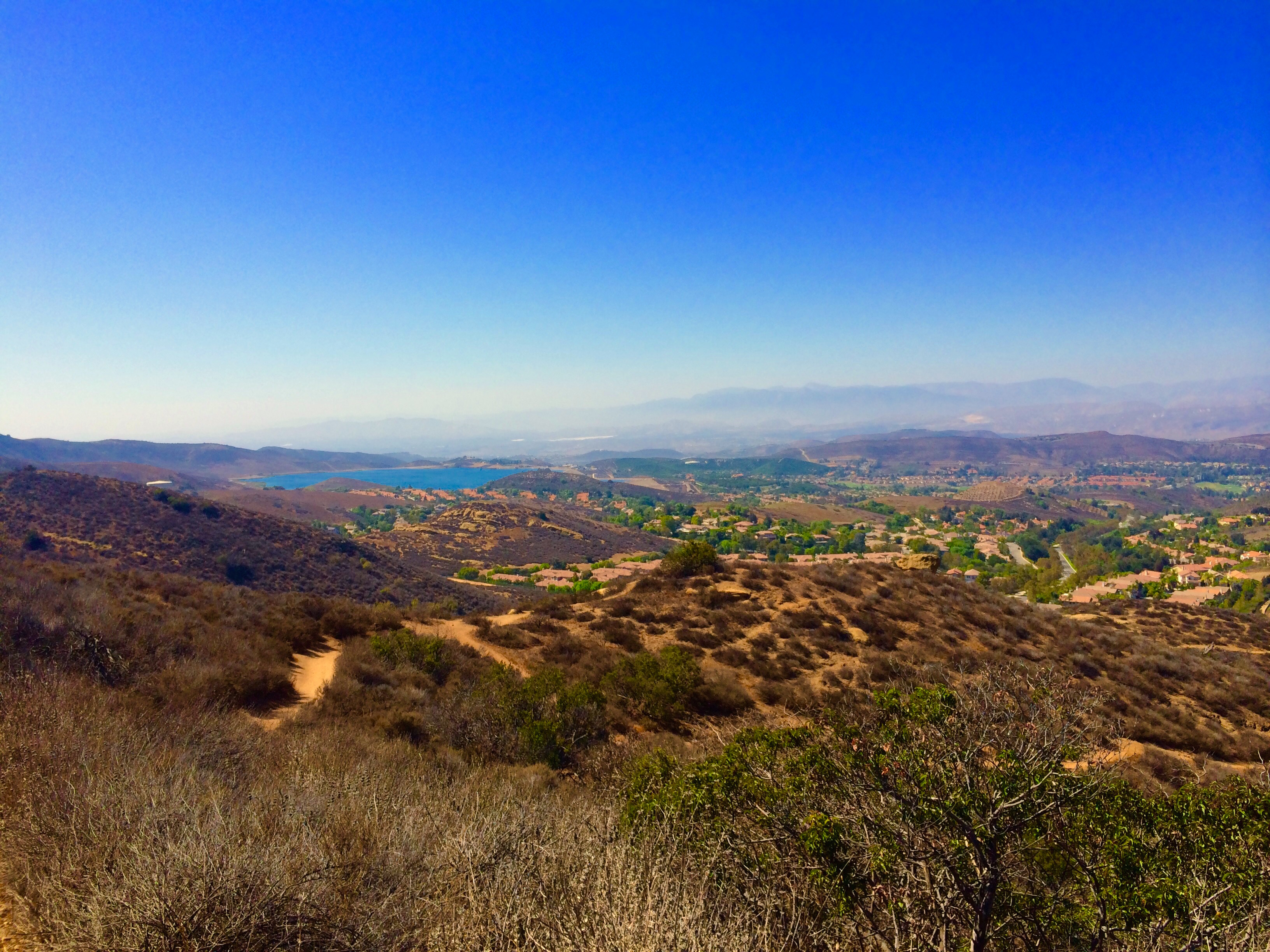 Panoramic view of a reservoir and rolling chaparral hills in Thousand Oaks.