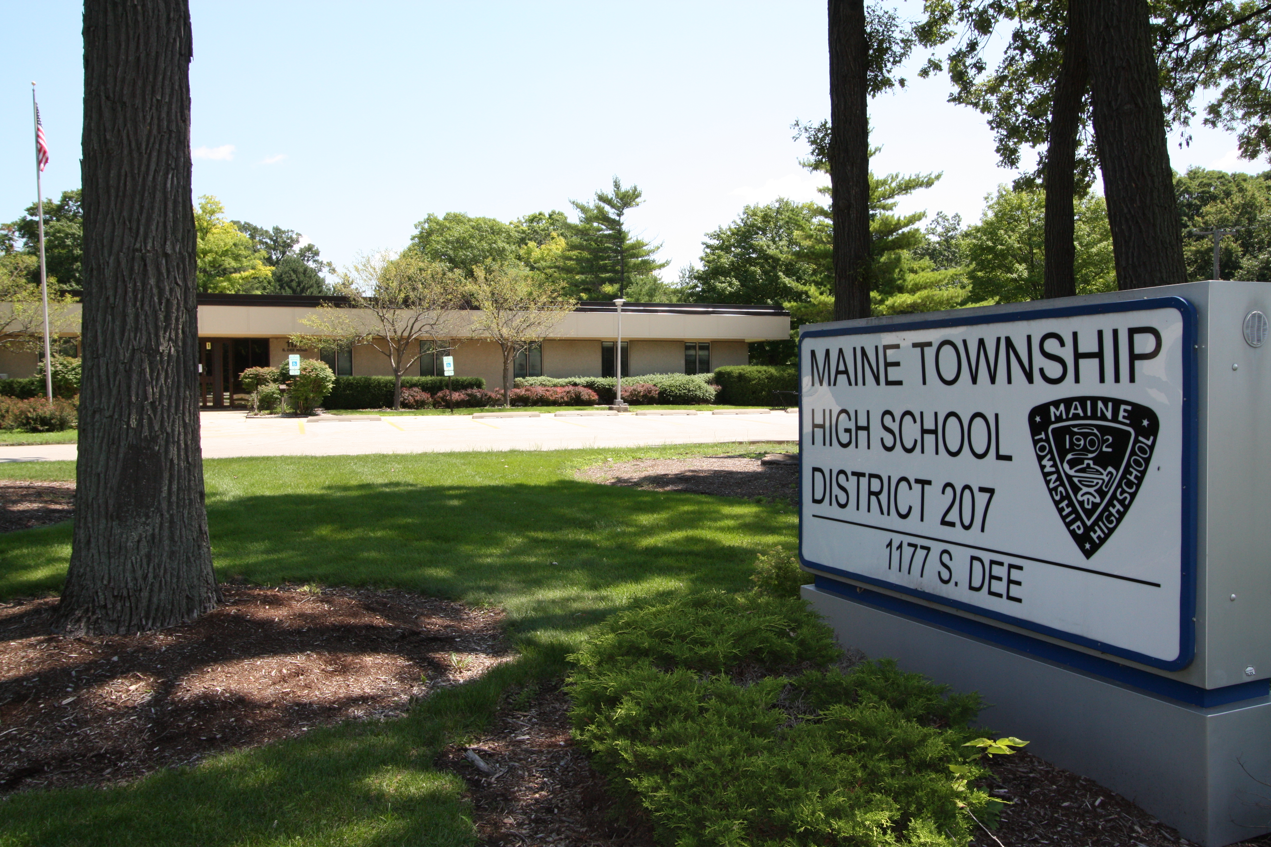 Sign marking the Maine Township High School District 207 administration building entrance.