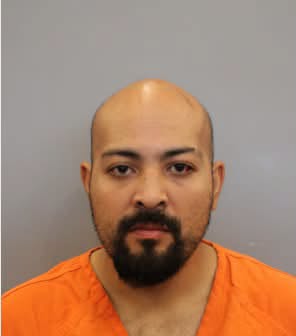 Arman Alexander Malik, a 34-year-old from Texas, has been charged with murder after cops found the remains of his 73-year-old mom stuffed in a duffle bag (Harris County Sheriff's Office)