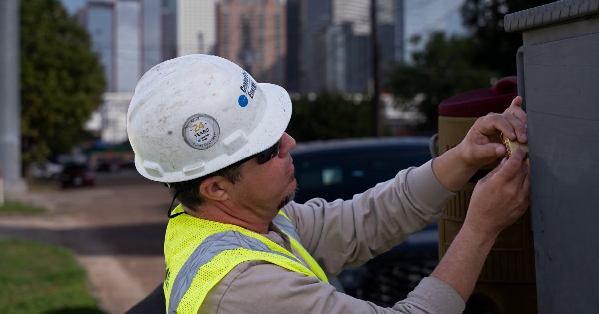 CenterPoint Energy Crew Member Working on Power Restoration Fixing