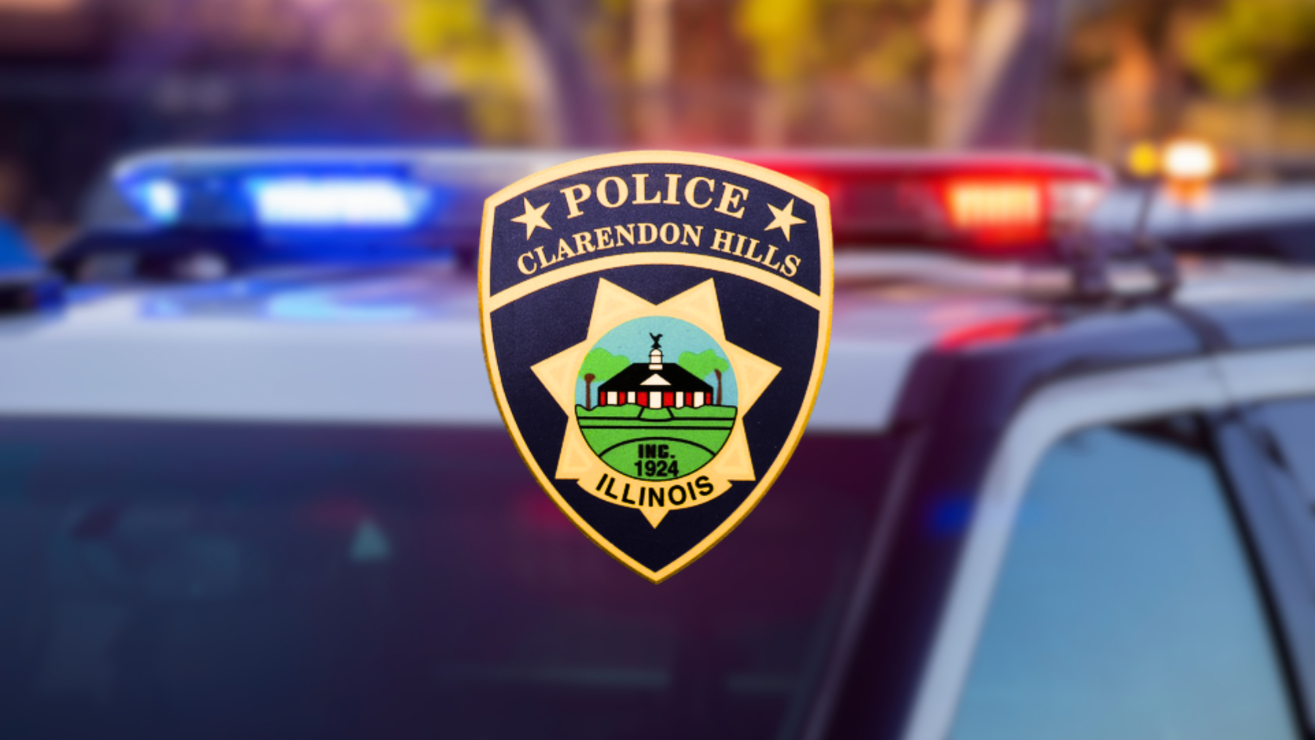 Logo of Clarendon Hills police badge on blurred police cruiser background.