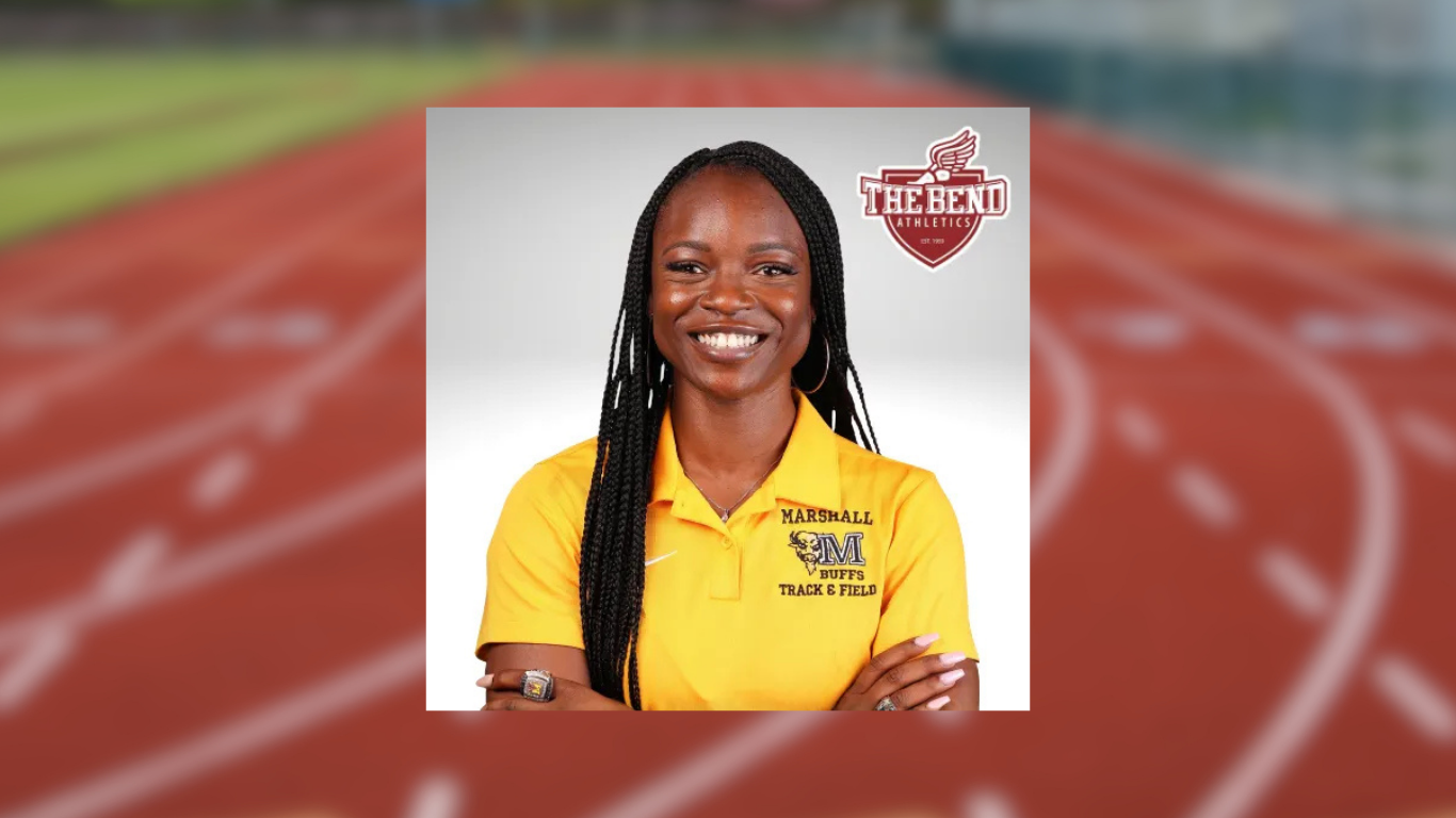 Portrait of a smiling female track and field coach wearing a yellow Marshall Buffs polo, centered over a blurred track background with The Bend Athletics logo in the upper right.
