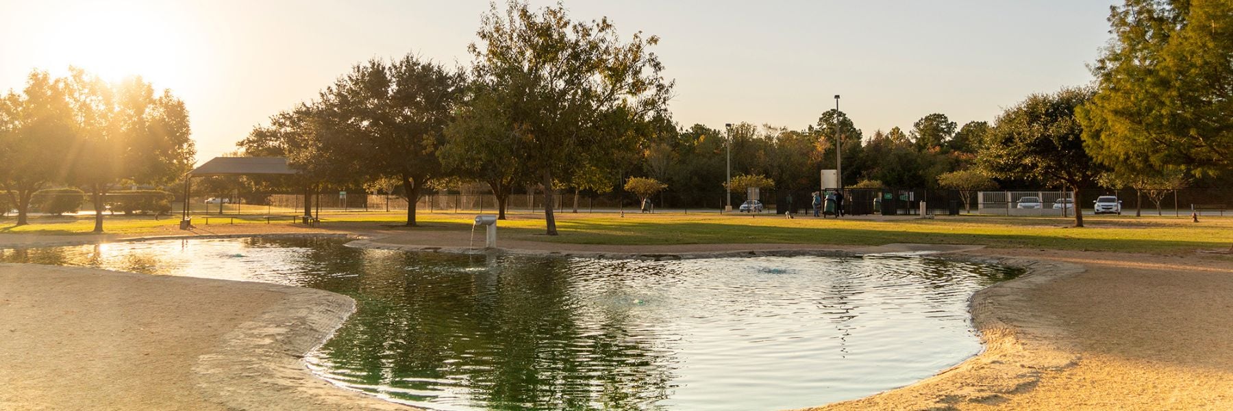 Dog park with large water area.