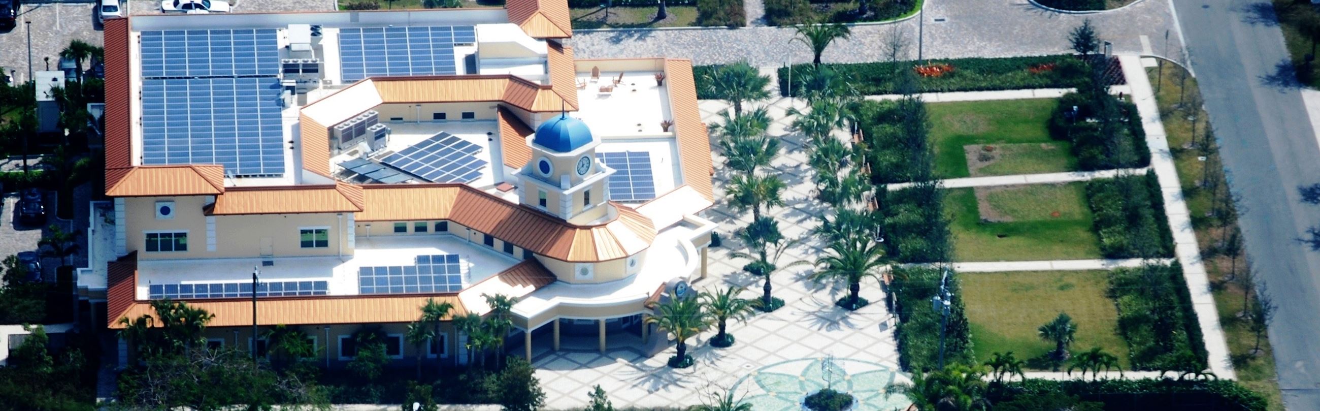 Aerial view of Palmetto Bay Village Hall with rooftop solar panels.
