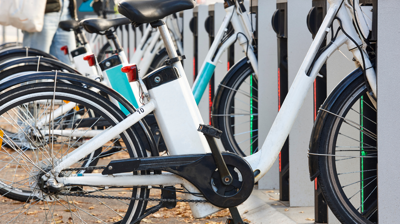 Electric bikes lined up for riders to take on city street