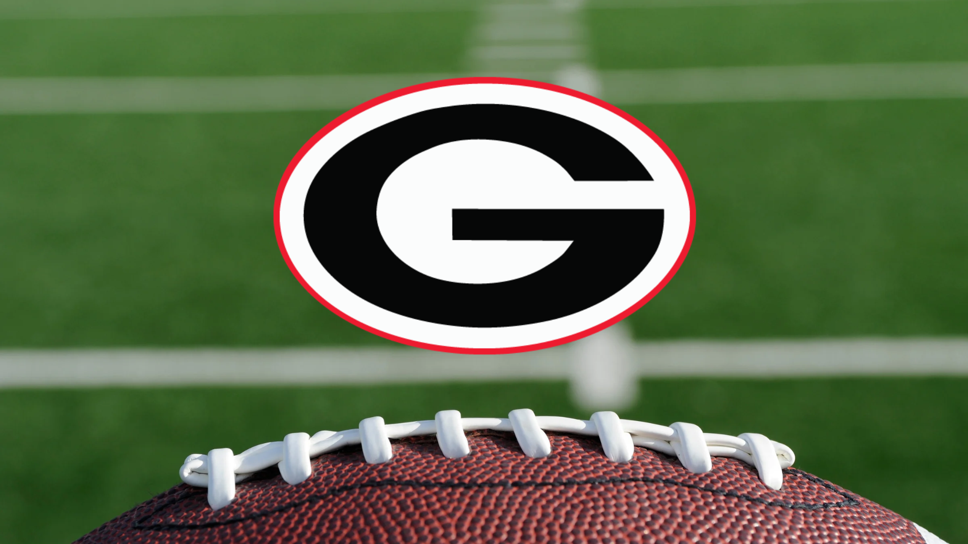 Glenbard East High School’s black, white and red G logo above a football on a blurred green field.