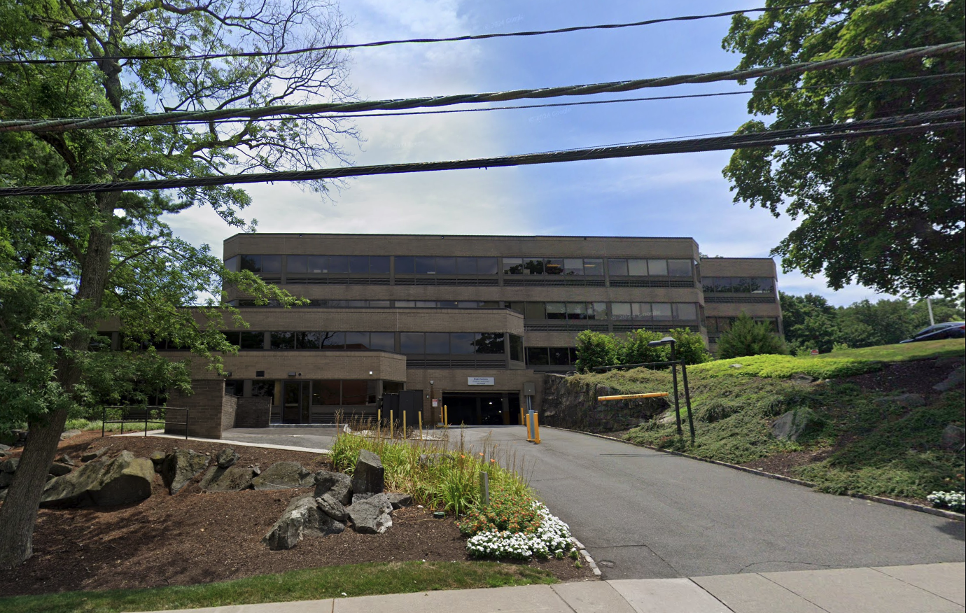 Three story medical building with parking garage.