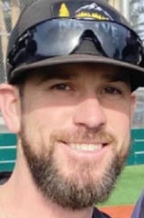 Jesse Lehane wearing a baseball cap and sunglasses on the brim.