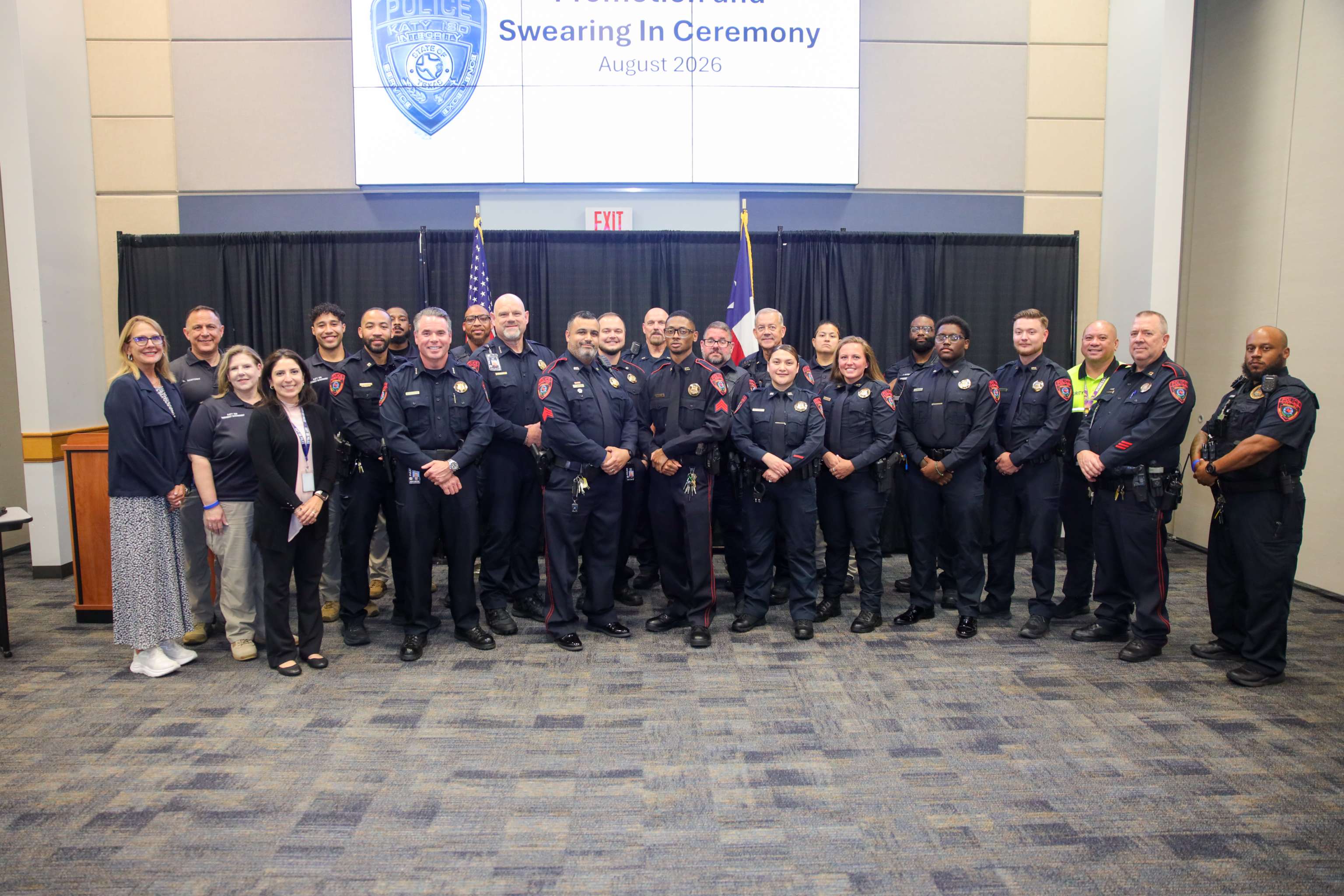 Officers pose for picture at ceremony.