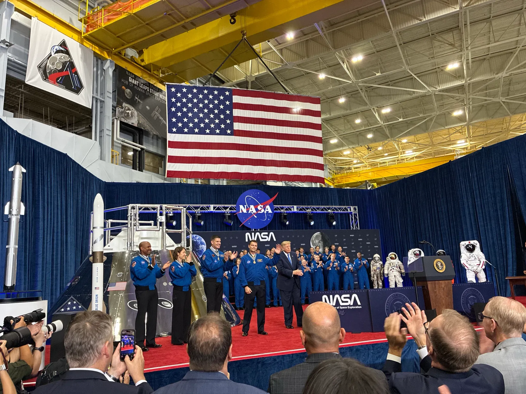 President trump stands with NASA crew at Johnson Space Center