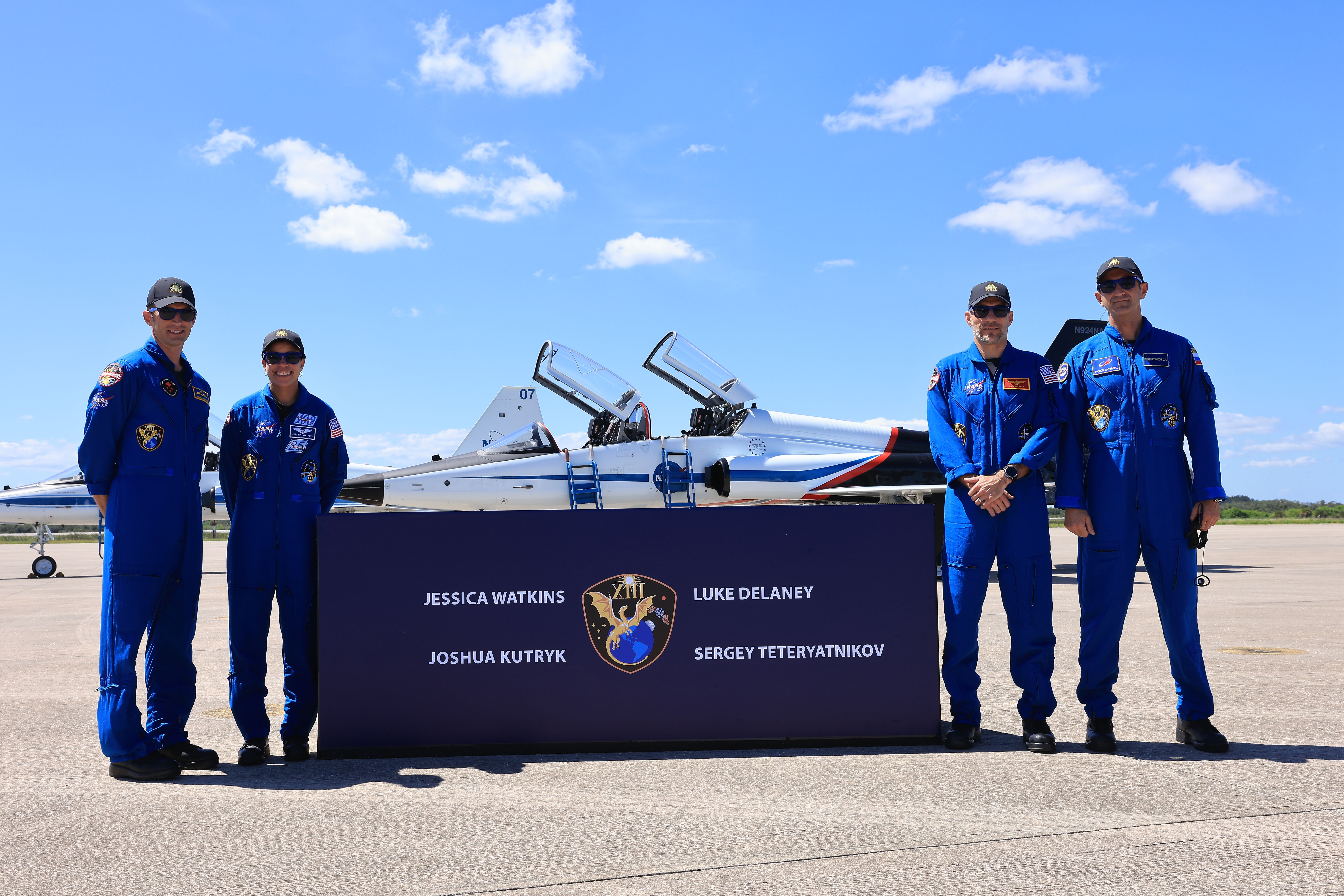 From left, crew members of NASA’s SpaceX Crew-13 mission, CSA (Canadian Space Agency) astronaut Joshua Kutryk, NASA astronauts Jessica Watkins and Luke Delaney, and Roscosmos cosmonaut Sergey Teteryatnikov arrive Saturday, Sept. 26, 2026, at the Shuttle Landing Facility at the agency’s Kennedy Space Center in Florida.