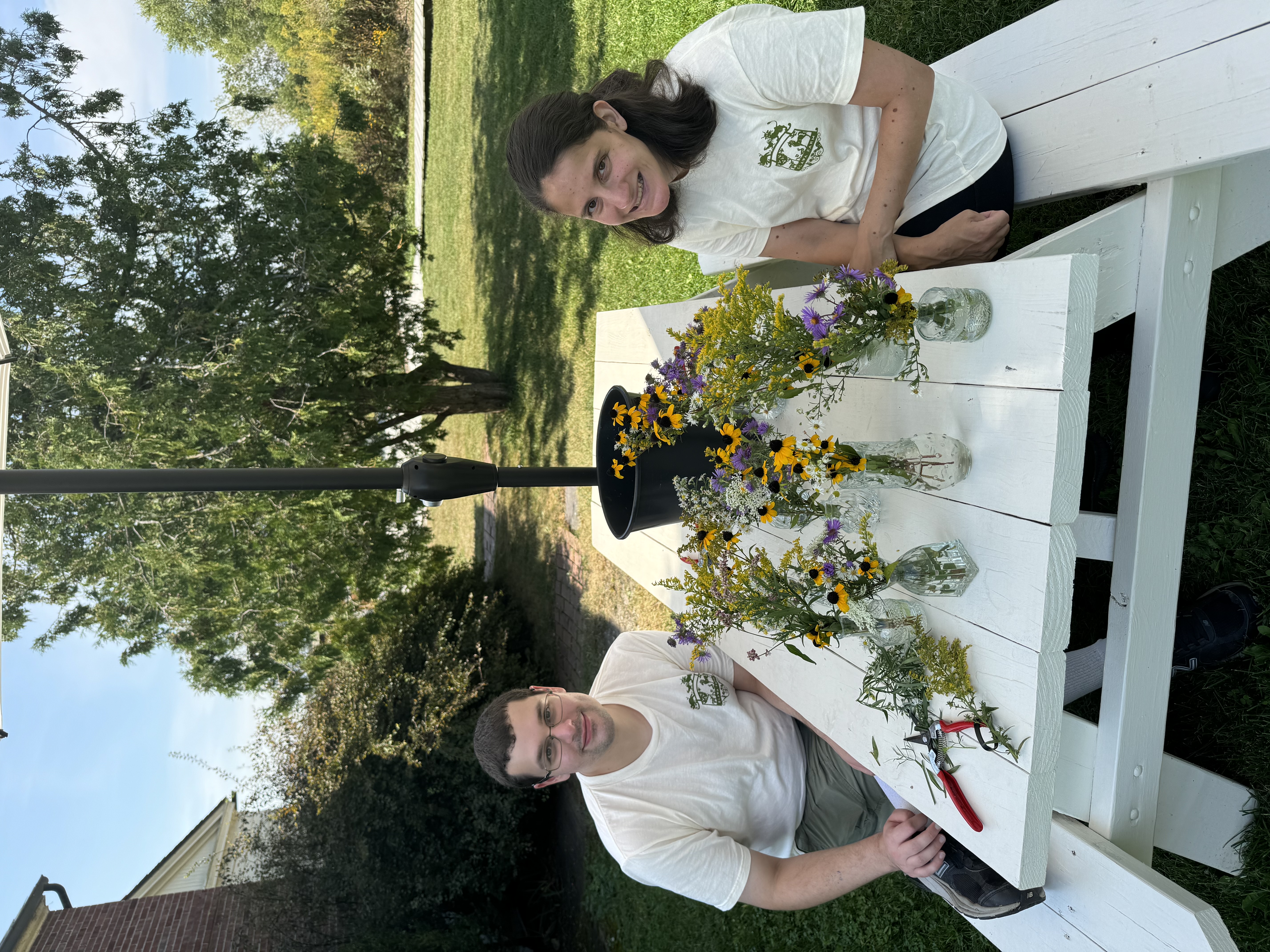Two people working on flowers at Elawa Farm