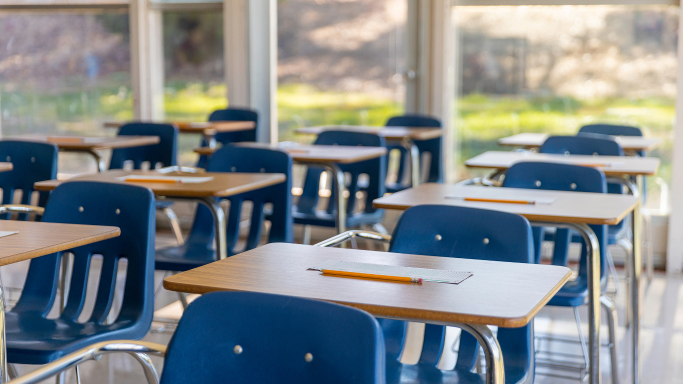 Seats inside a school classroom are empty