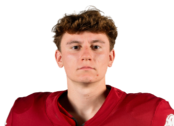 Portrait of a young male football player wearing a red jersey against a transparent background.