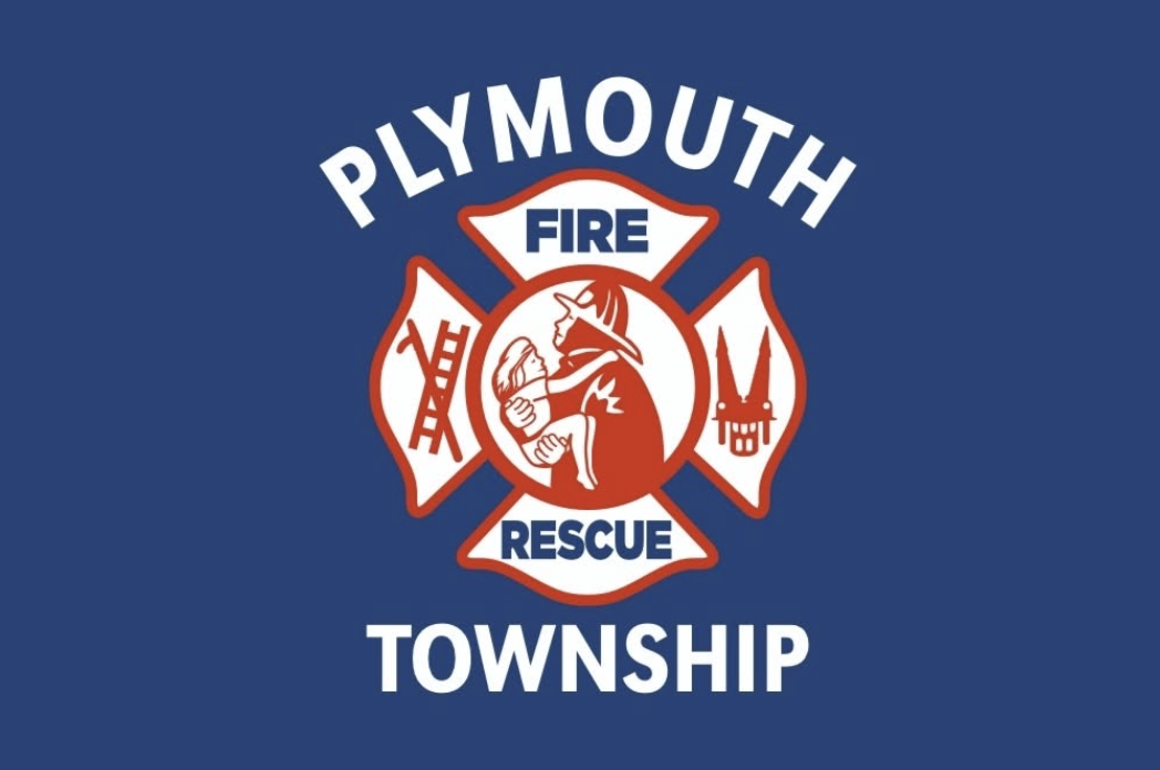 Plymouth Township Fire Rescue badge logo, featuring a firefighter carrying a child inside a red Maltese cross on a dark blue background.