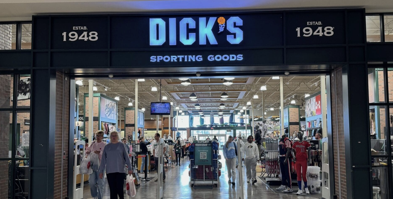 Exterior of a Dick's Sporting Goods store, showing the storefront signage and entrance.