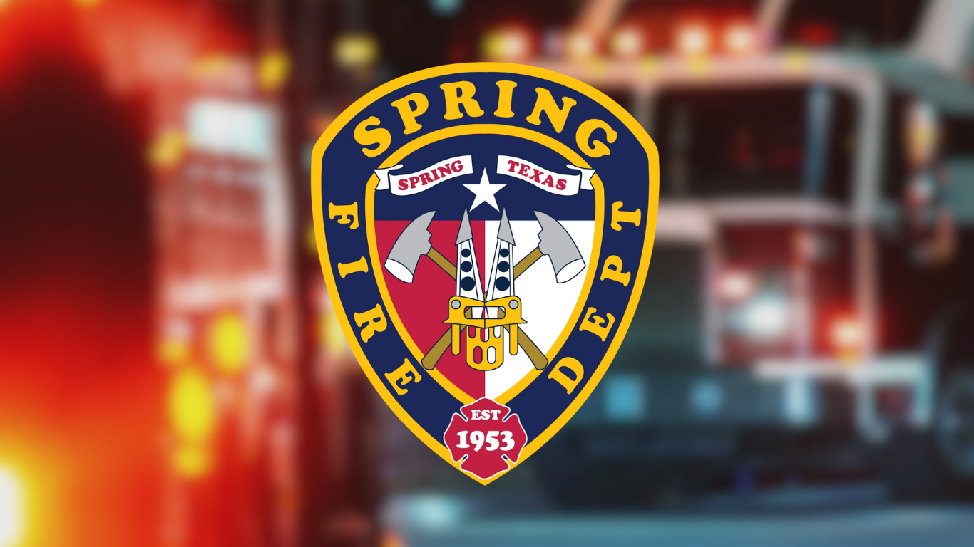 Spring Fire Department logo featuring a red, white and blue shield with crossed fire axes, firefighter equipment and the words “Spring Fire Department” and “Est. 1953.”