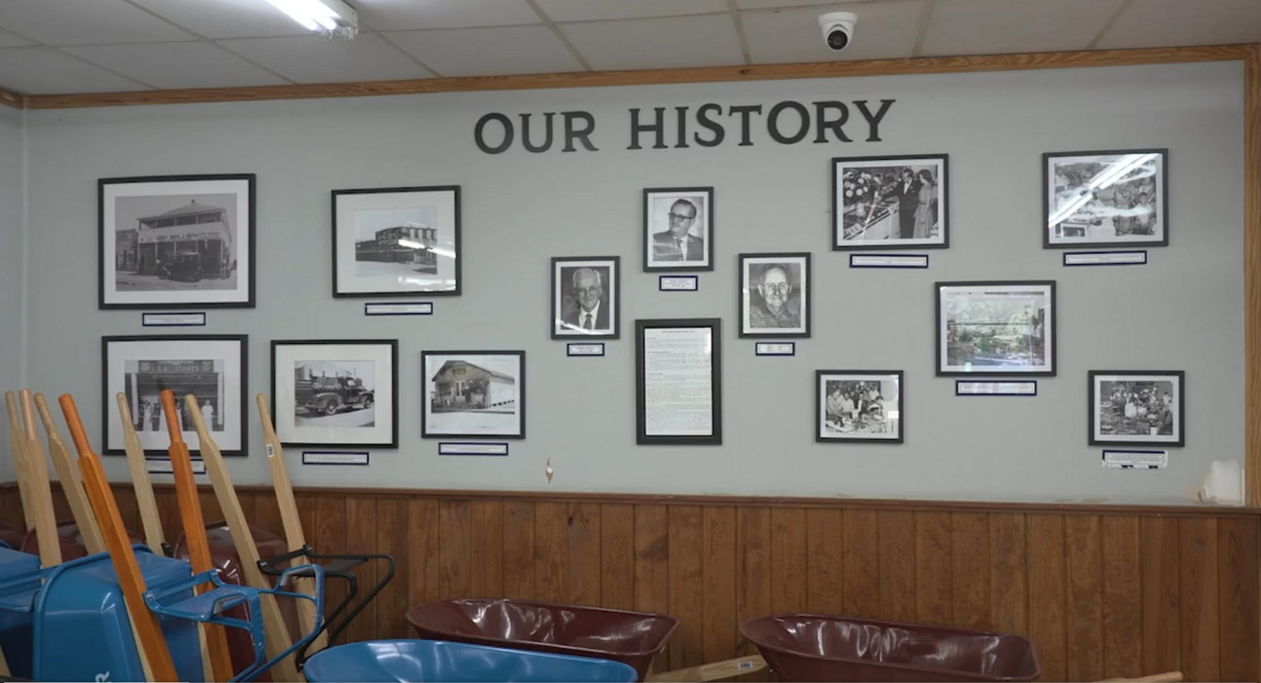 Wall showing history of store in frames.
