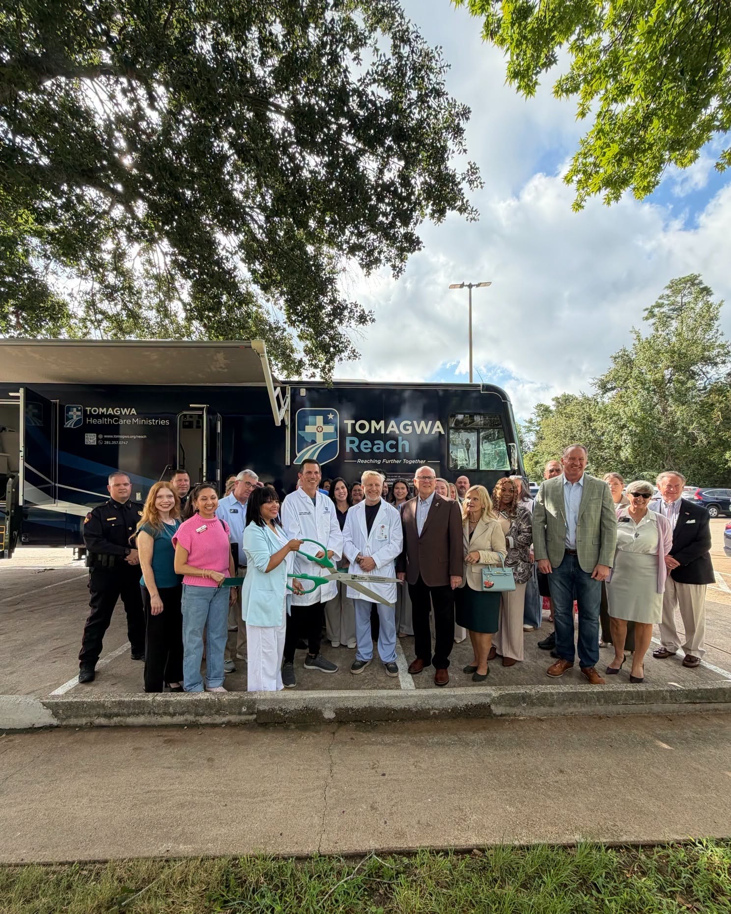 Doctors, nurses and city officials gather for ribbon cutting of mobile health clinic