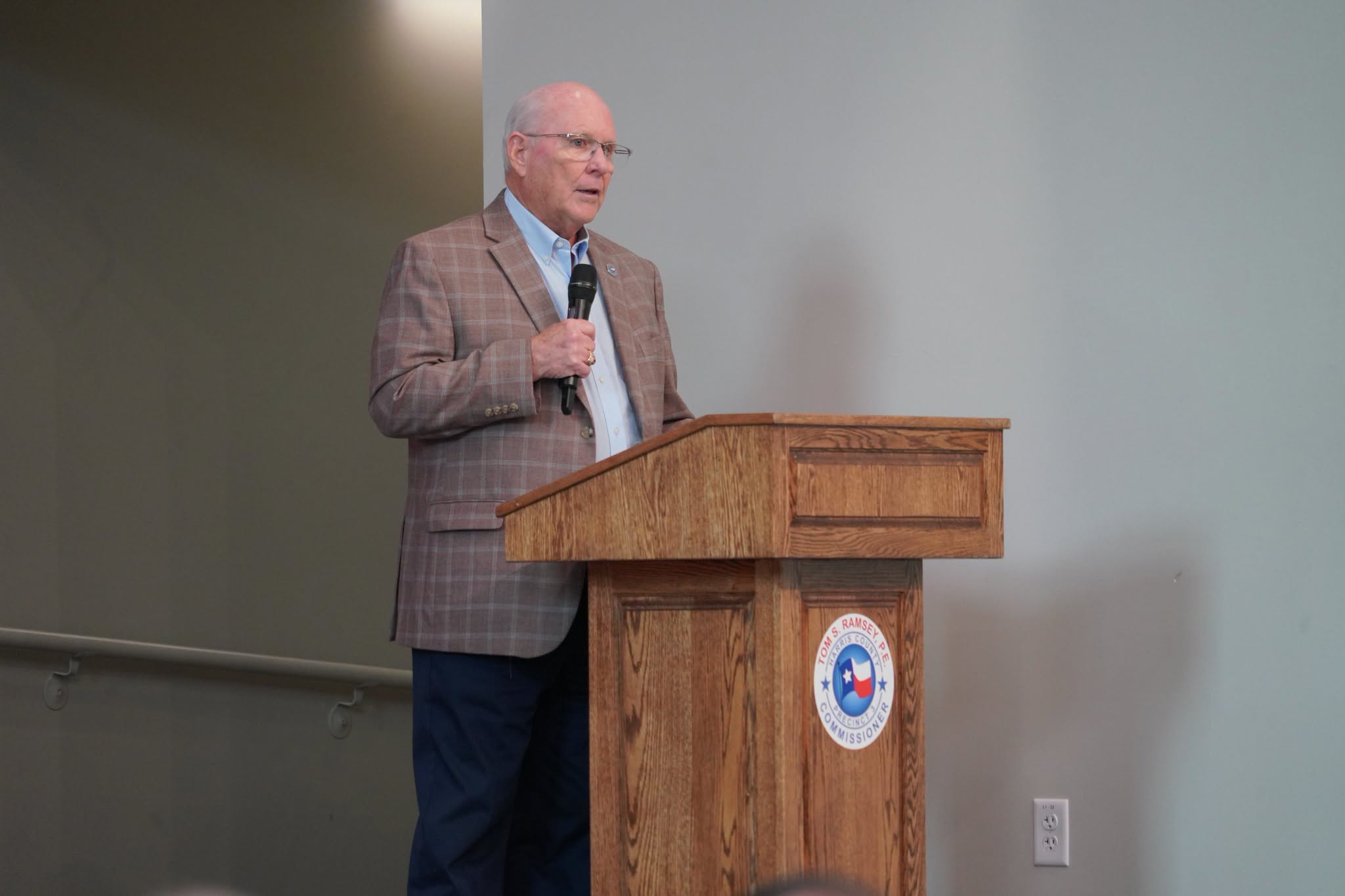 Man speaking at podium in Harris County TX.