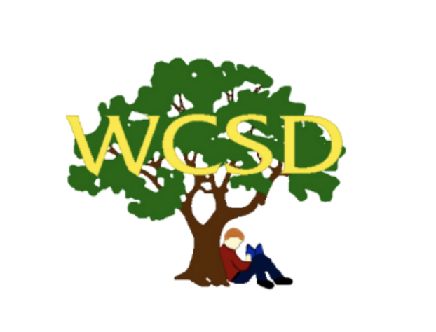 The Walnut Creek School District logo, showing a child reading beneath a large tree with "WCSD" spelled out in the branches.