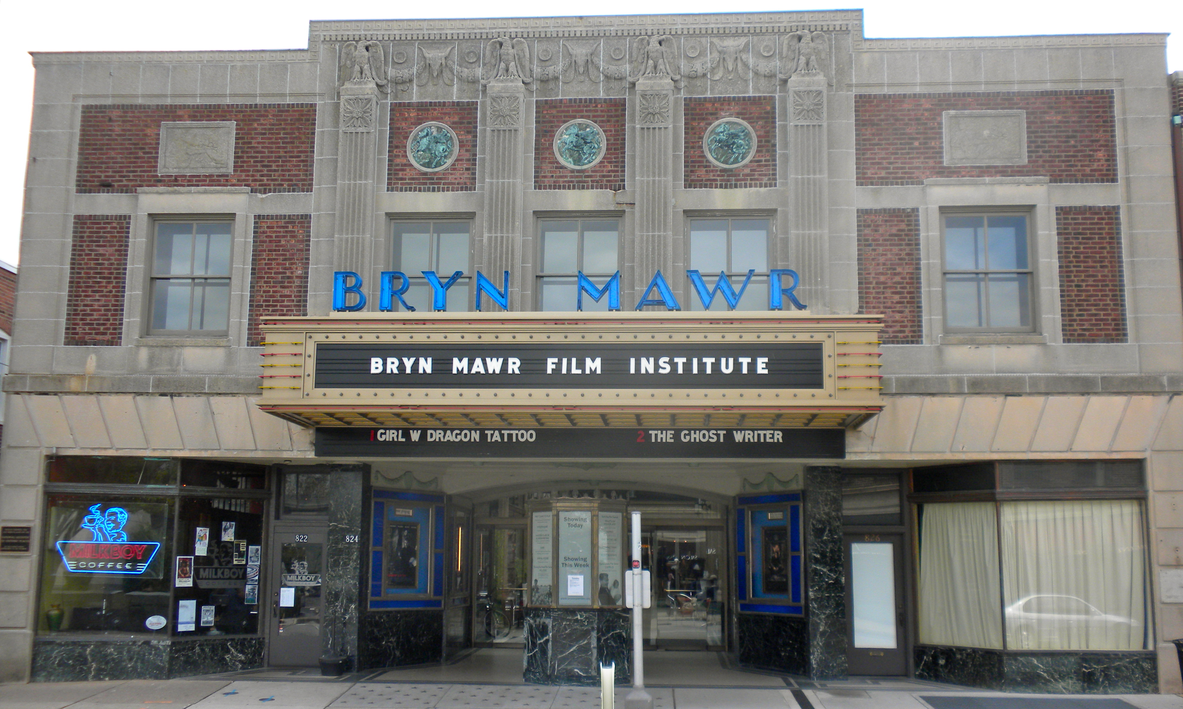 Brick beaux arts theater building with a marquee reading Bryn Mawr Film Institute.