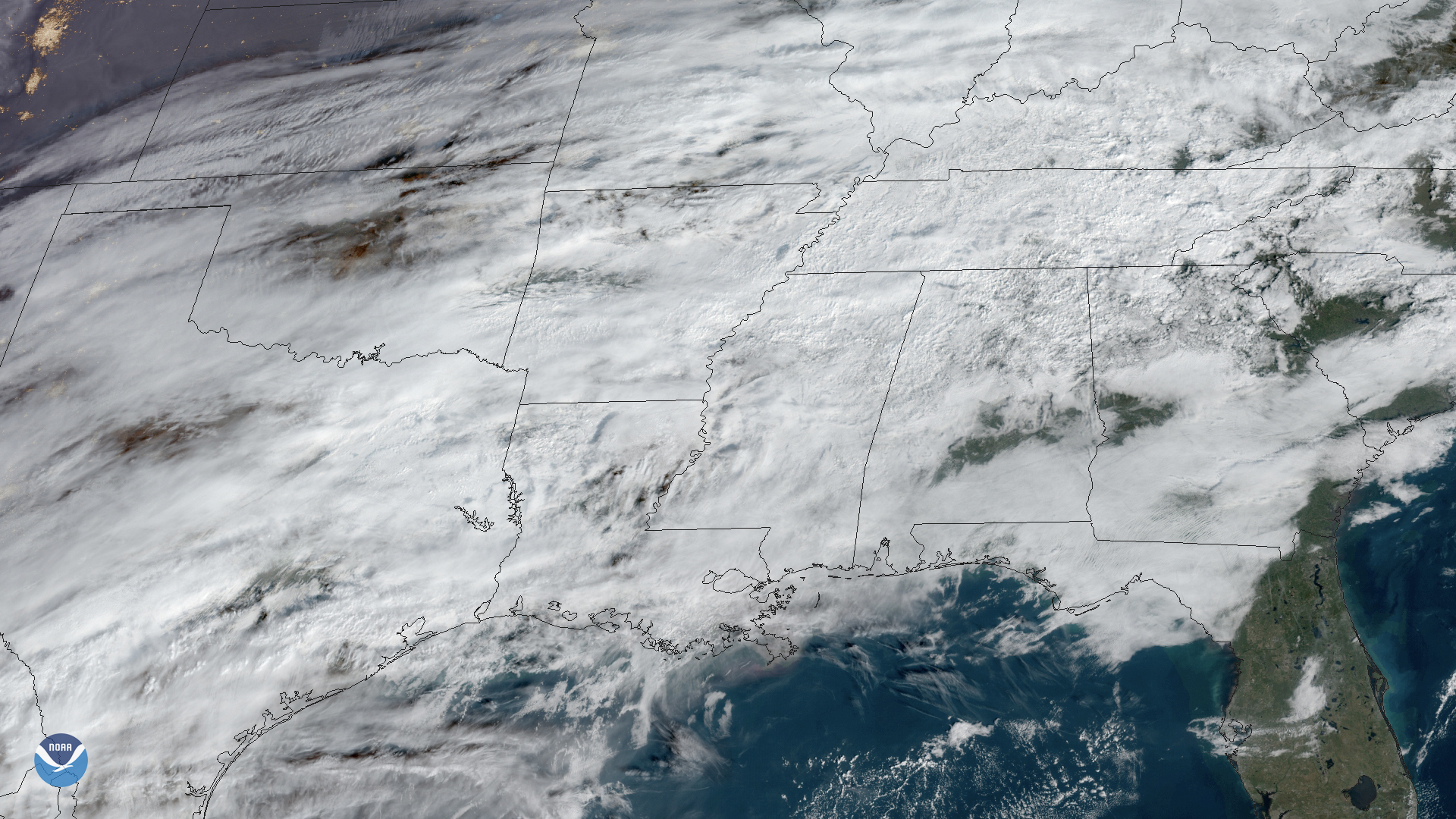 Satellite image showing widespread cloud cover and storm systems over the United States.