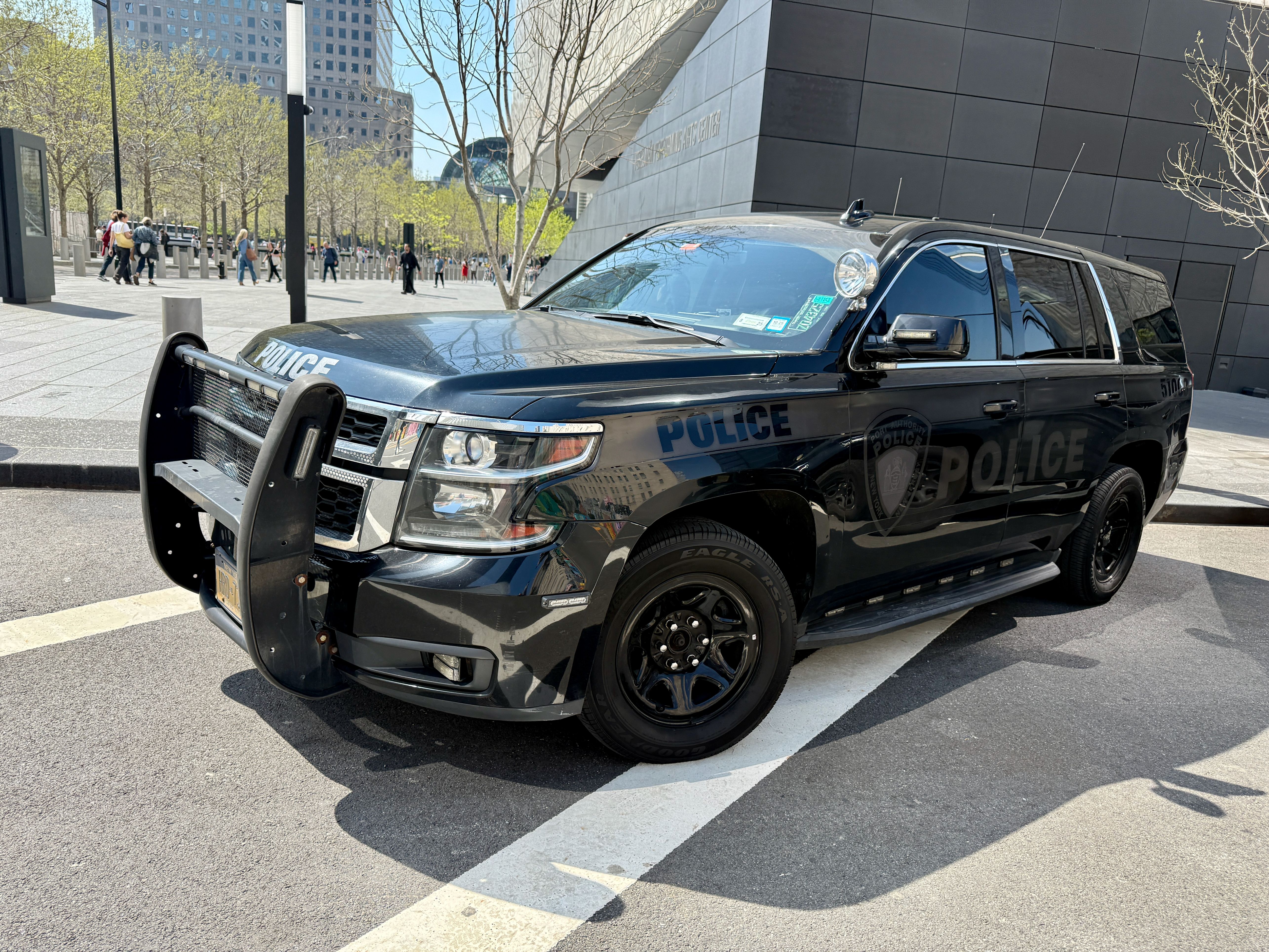 Black police pursuit SUV with push bumper parked outdoors.