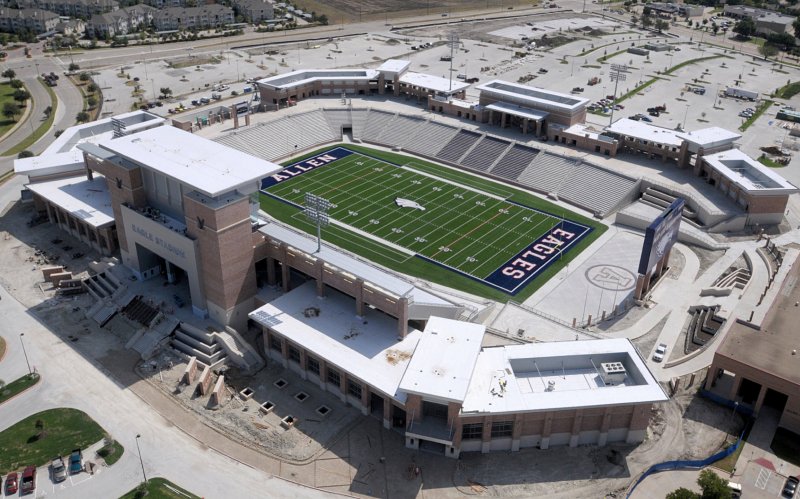 Aerial view of a football field with 'Eagles' and 'Allen' painted on green turf.