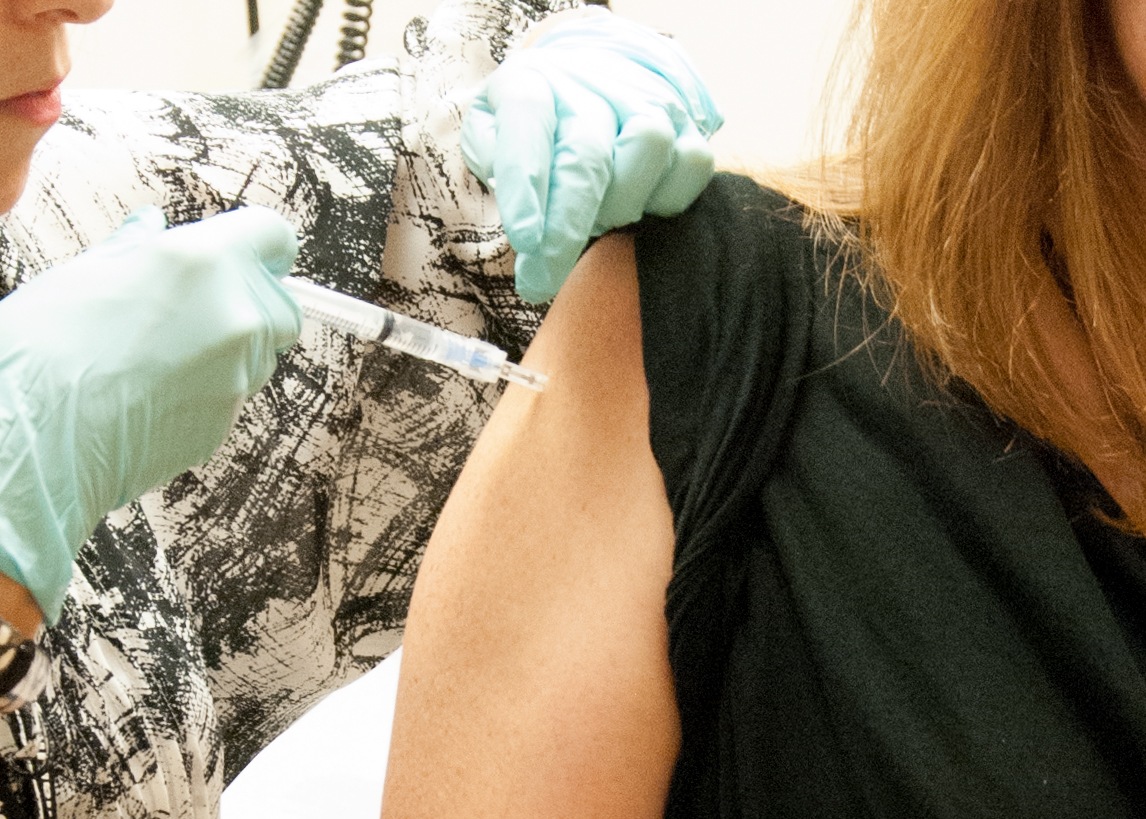 September 2, 2014 — A 39-year-old woman, the first participant enrolled in VRC 207, receives a dose of the investigational NIAID/GSK Ebola vaccine at the NIH Clinical Center in Bethesda, Md. Credit: NIAID