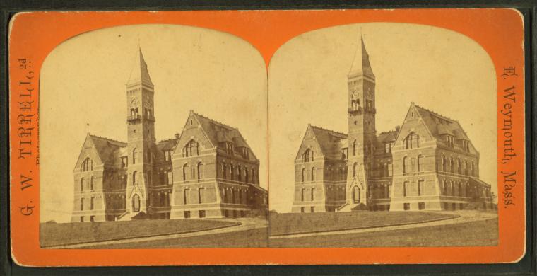Large brick Victorian school building with a tall clock tower, in a stereograph format.