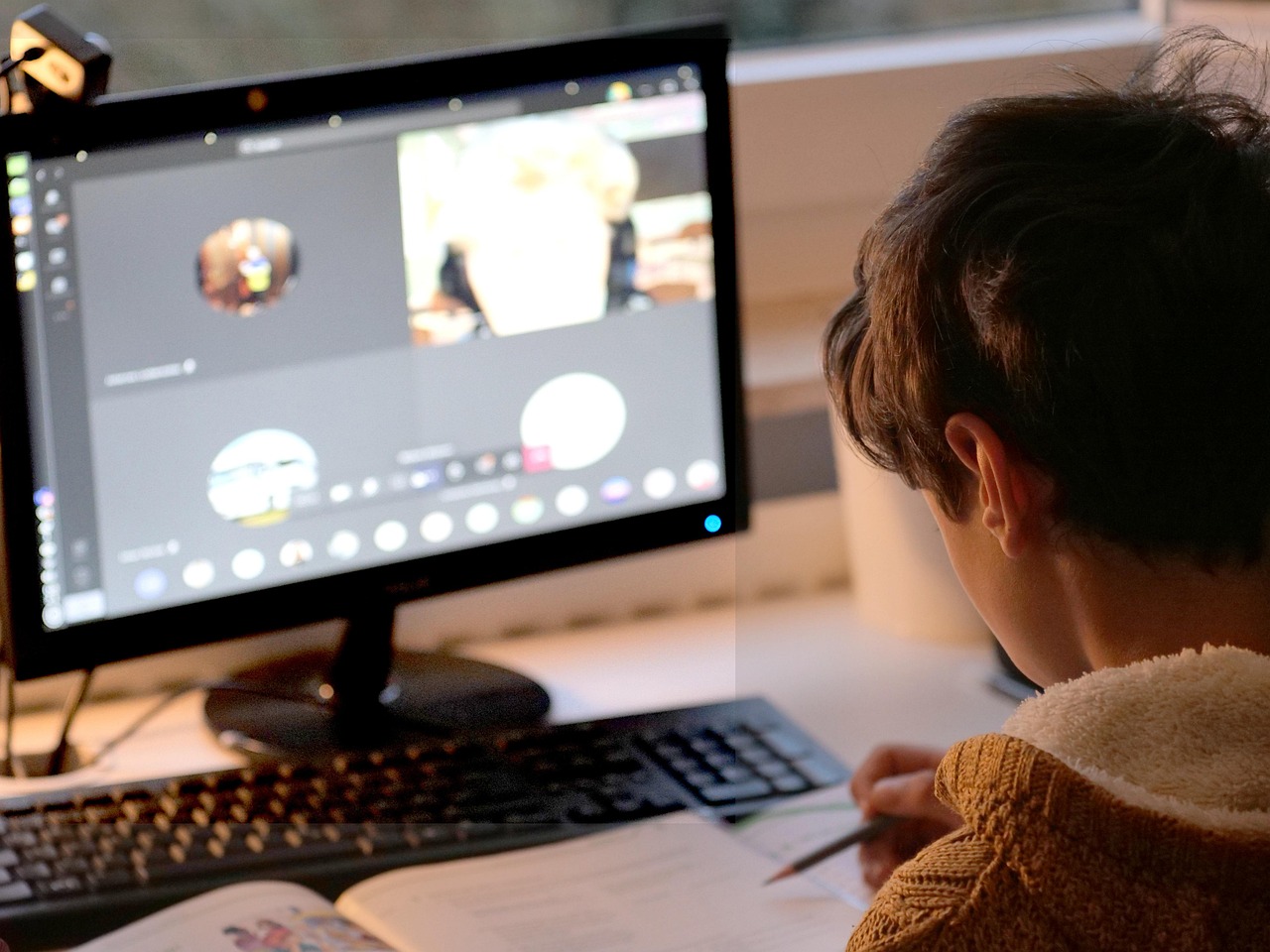Child, student, video conference, computer, monitor, screen, webcam, video call, education, e-learning, distance learnin