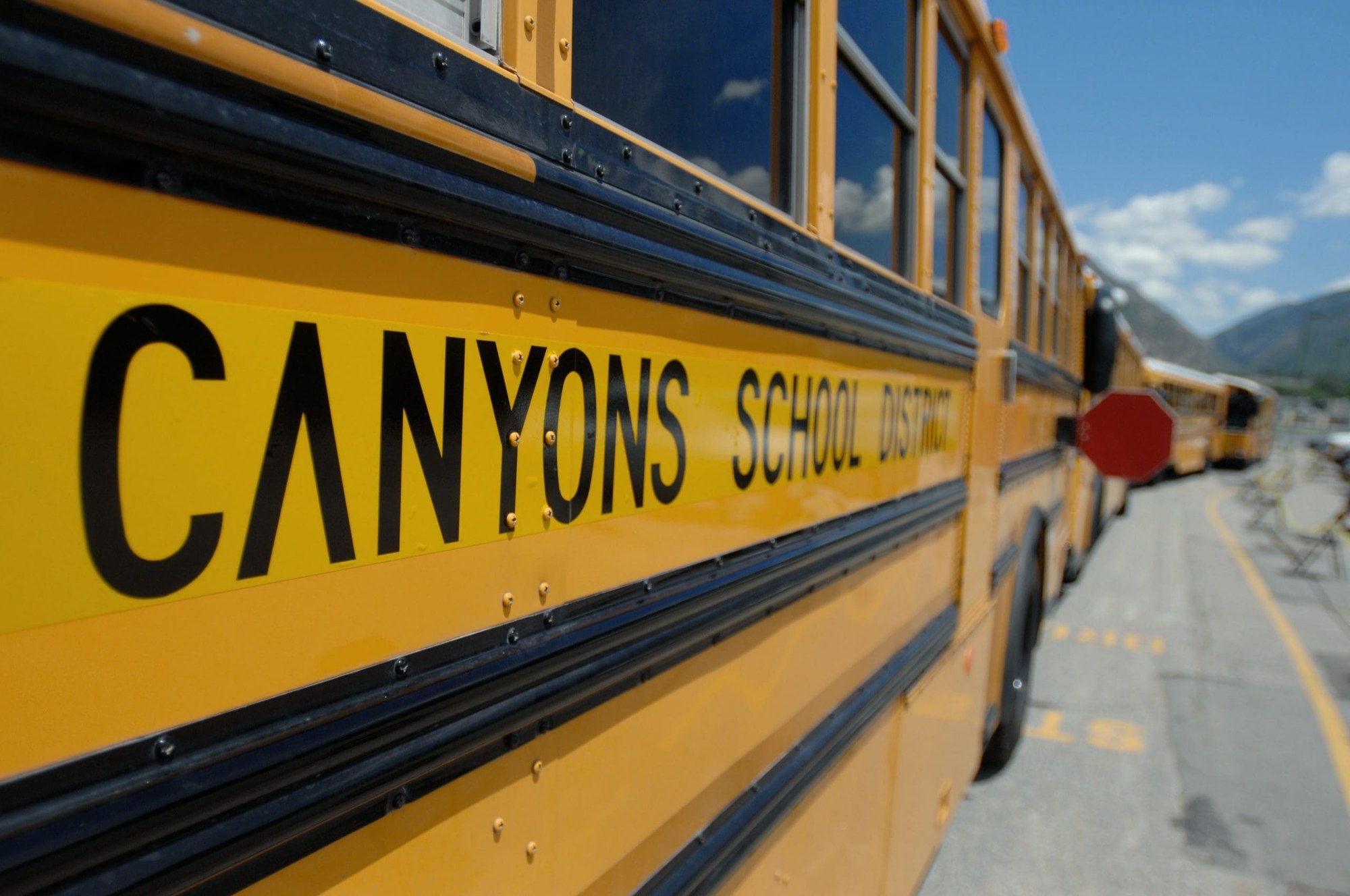 Yellow school bus with Canyons School District lettered on its side.