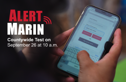 Graphic reading 'Alert Marin, Countywide Test on September 26 at 10 a.m.,' beside a photo of a hand holding a phone showing the AlertMarin sign-up screen."