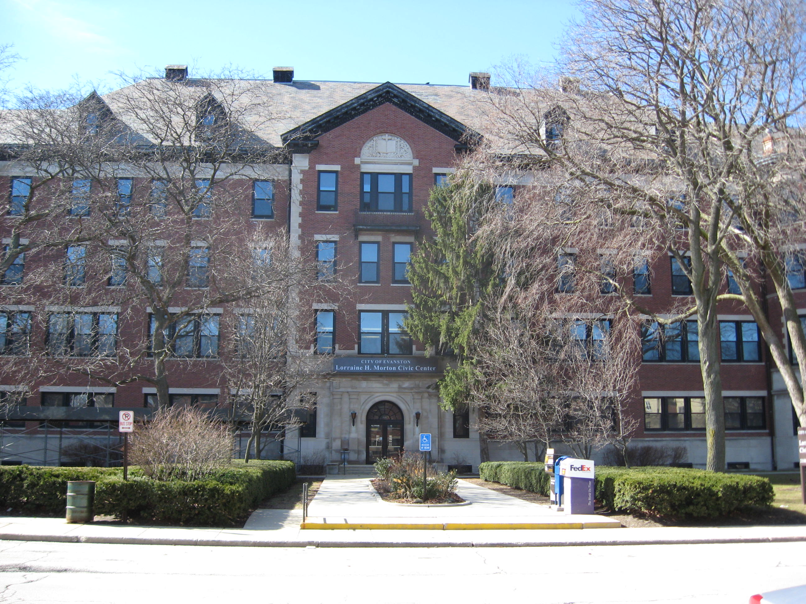 Brick exterior of the Evanston Civic Center building on a sunny day.