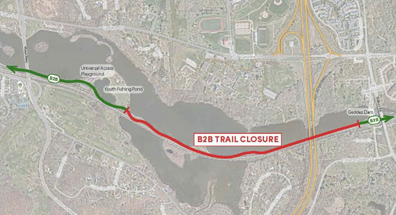 A map showing the closed section of the Border-to-Border Trail (marked in red) between Geddes Dam and the Youth Fishing Pond near the Universal Access Playground, with open trail sections marked in green.
