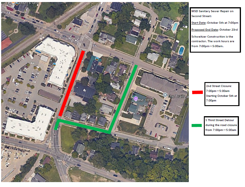Aerial map with red line marking a road closure and green line marking a detour route.