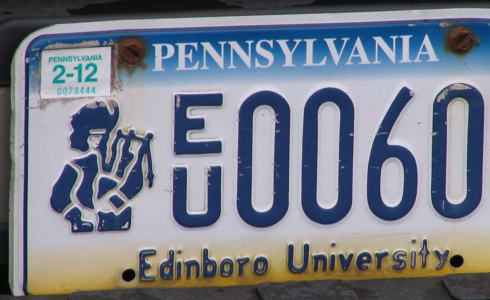 A blue and white Pennsylvania specialty license plate with a university logo.