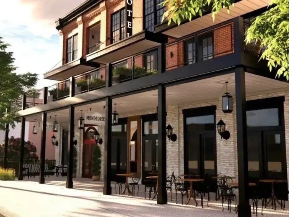 Architectural rendering of a covered outdoor dining patio with café tables beneath a black metal canopy.