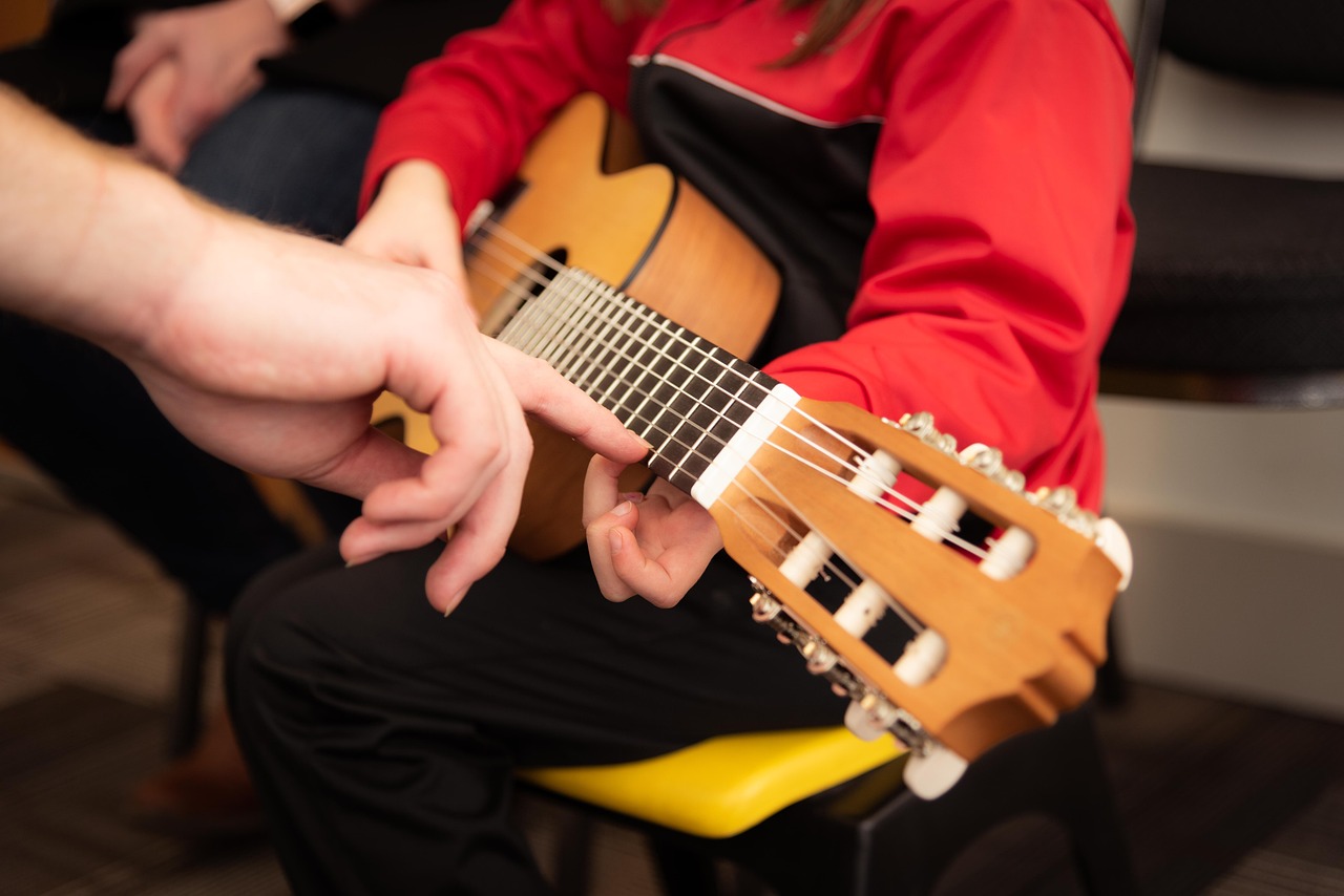 Guitar, studying, playing, showing, teaching, lesson, class, strings, kid, child, acoustic, acoustic guitar, instrument,