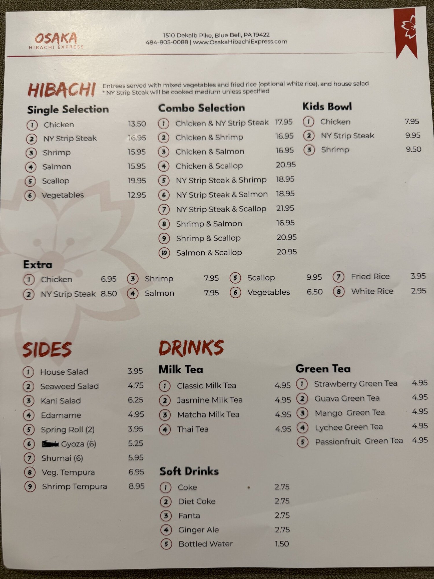 A printed restaurant menu showing hibachi selections, combo plates, and drinks with prices.