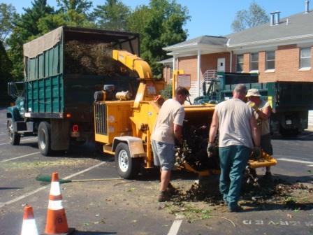 brush chipper and workers in action