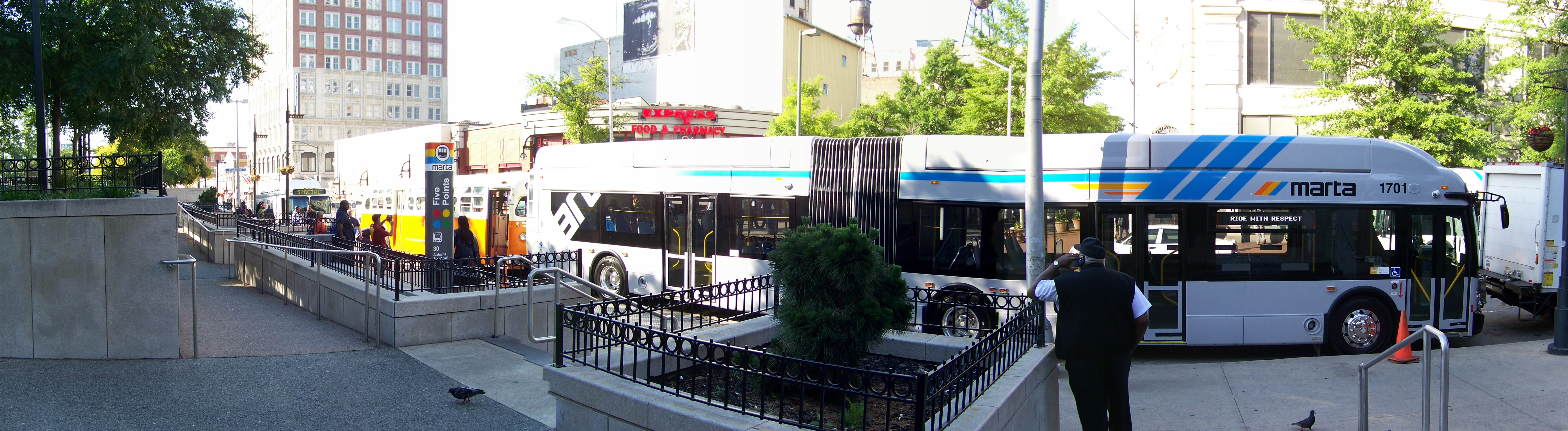 MARTA buses lined up at an outdoor transit plaza in Atlanta.