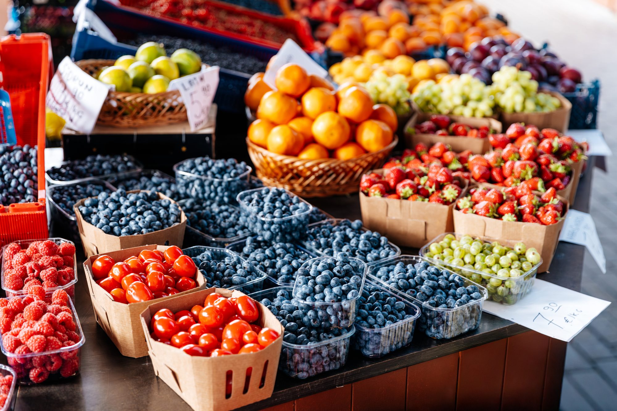 Fresh fruits, berries and vegetables on the market stall a farmer's market