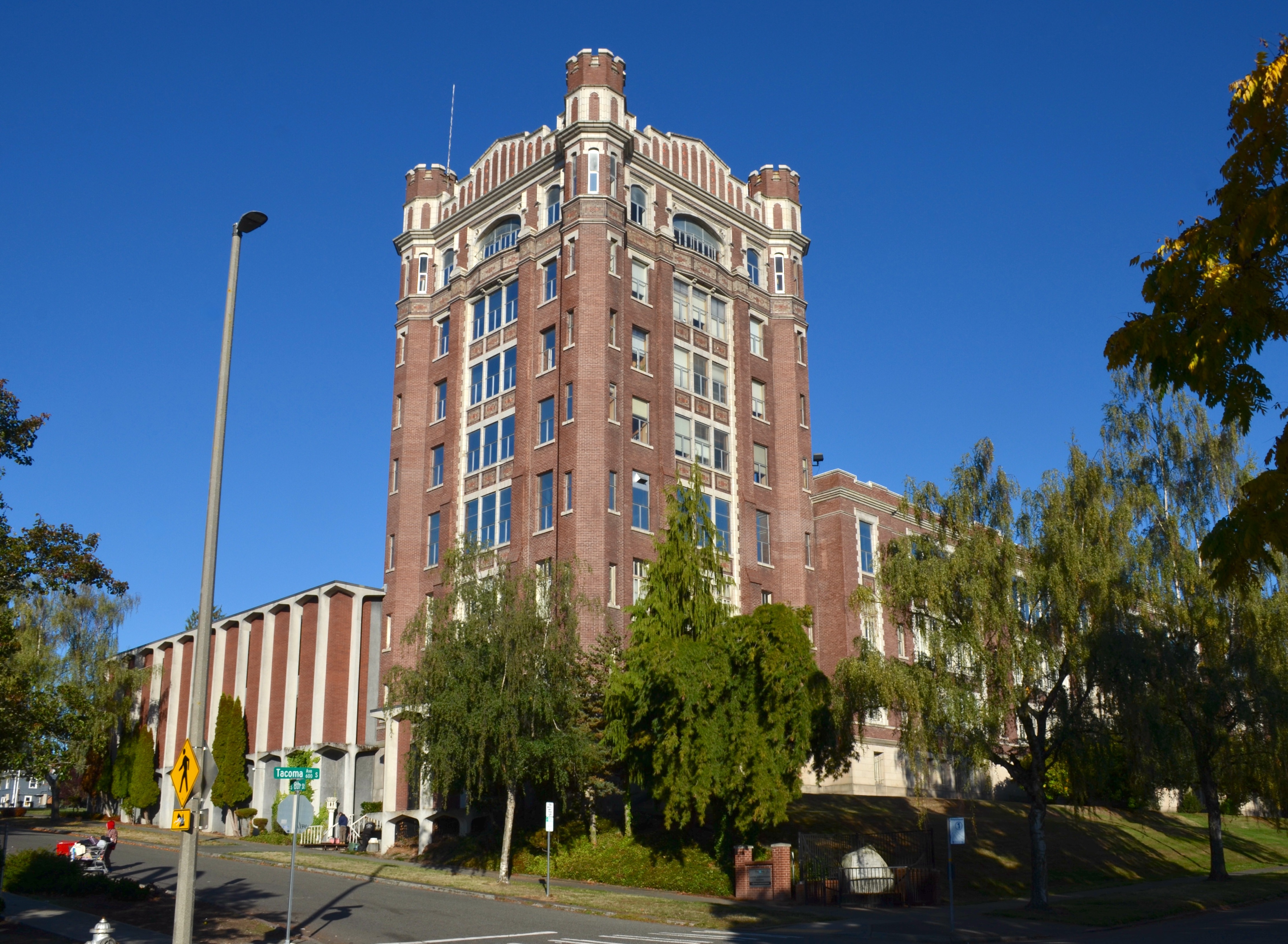 Historic red brick building with ornate upper-story details, serving as the Tacoma Public Schools headquarters.